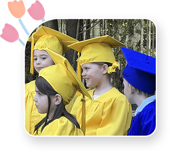 A group of children in graduation caps and gowns.